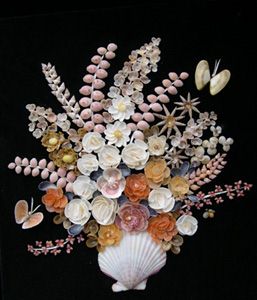 Shell picture of flowers in vase
